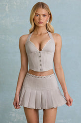 Low-Rise Pleated Mini Skirt in Ecru