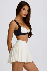 Soft Active Crossover Pleated Mini Skort in Ivory